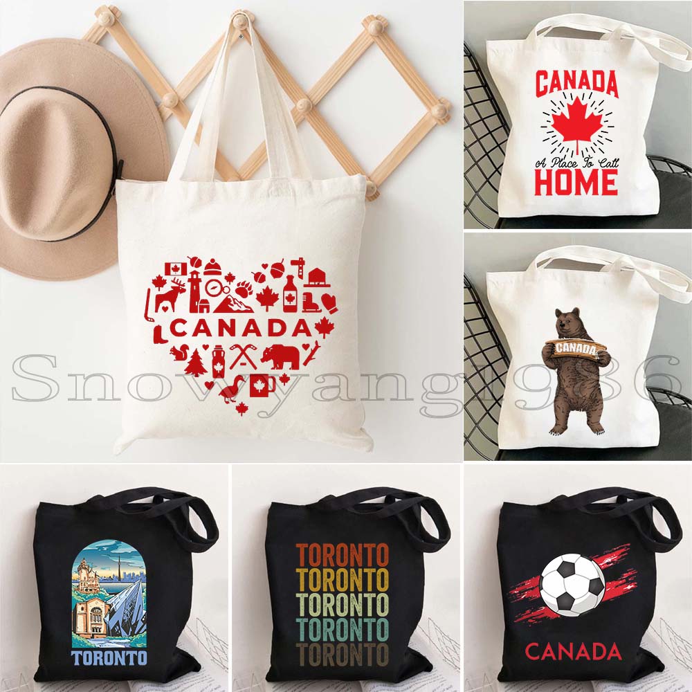 Women Bags Canada - กระเป๋าผ้าแคนวาสลายธงชาติแคนาดา สาวแคนาดาสุดน่ารัก ท่องเที่ยวที่โตรอนโต ของที่ระลึกสำหรับผู้หญิงและผู้ชาย สไตล์ฮาราจูกุ สะพายไหล่หรือถือก็ได้